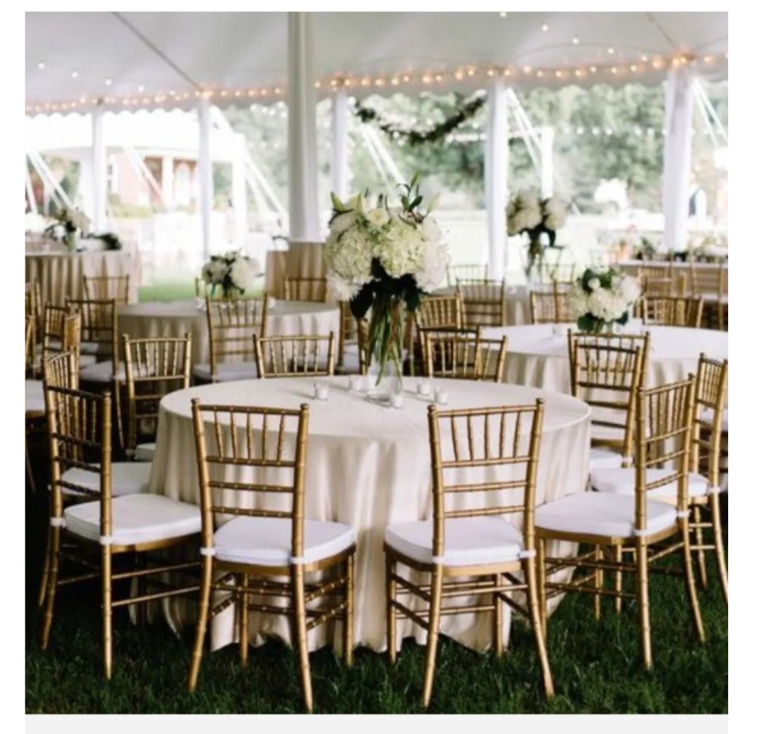 Chiavari Wedding Package — round tables with white linens and gold chiavari chairs under a tent