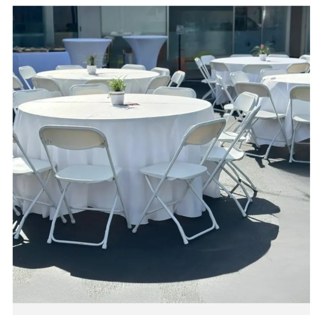 Classic Wedding Package — round tables with white linens, charger plates, and elegant place settings