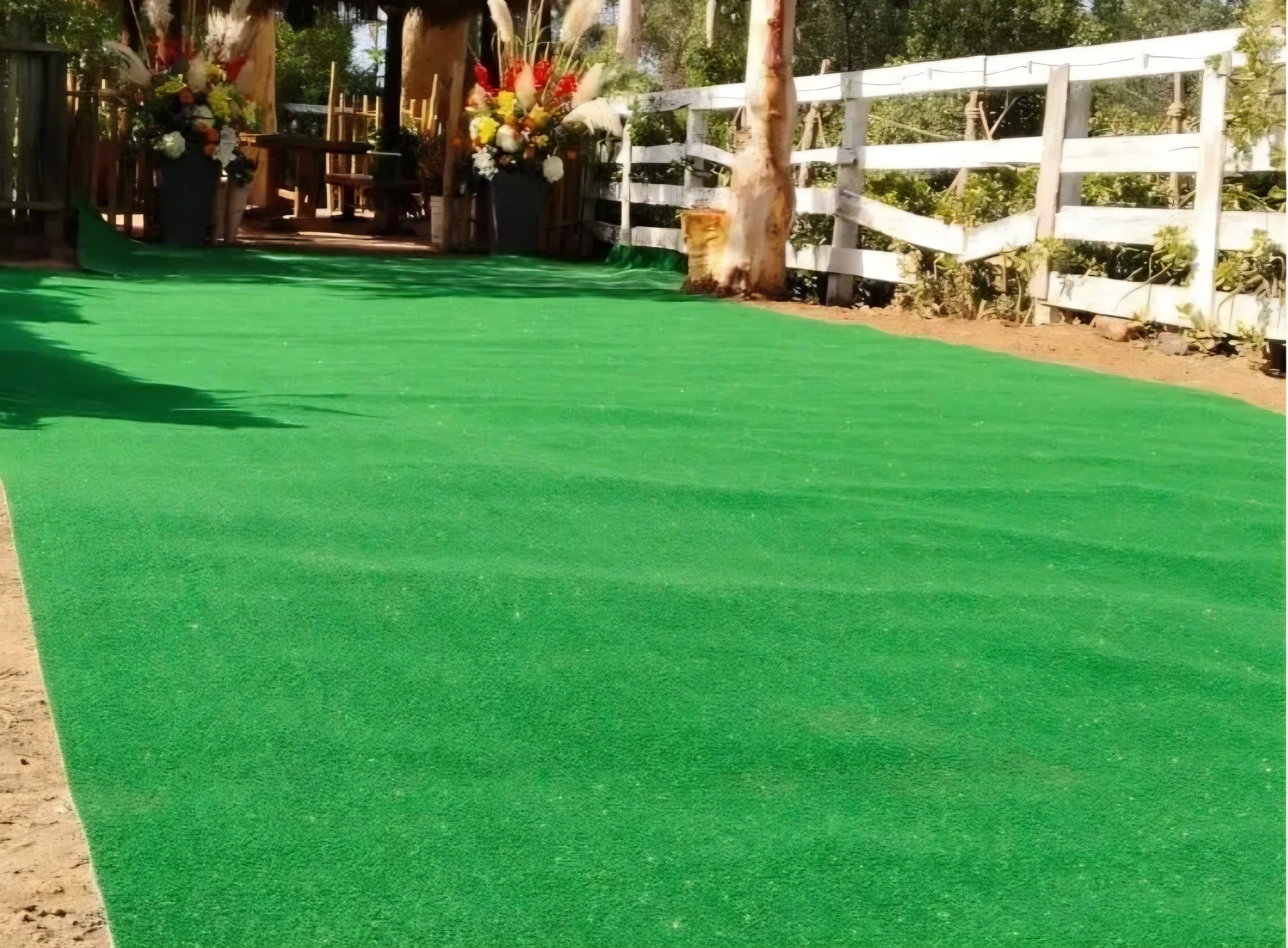 Lush green artificial turf laid out at an outdoor event venue